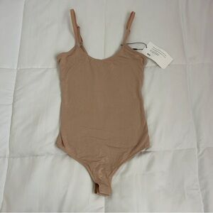 The Kit. Tan bodysuit in Size 2